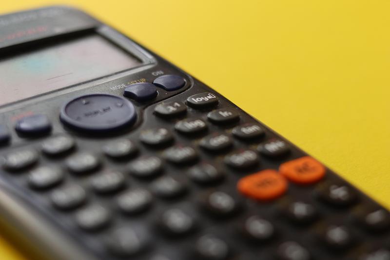 Scientific calculator and yellow background