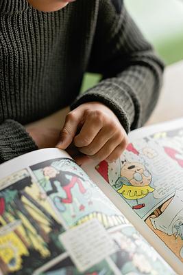 Person reading comic book 